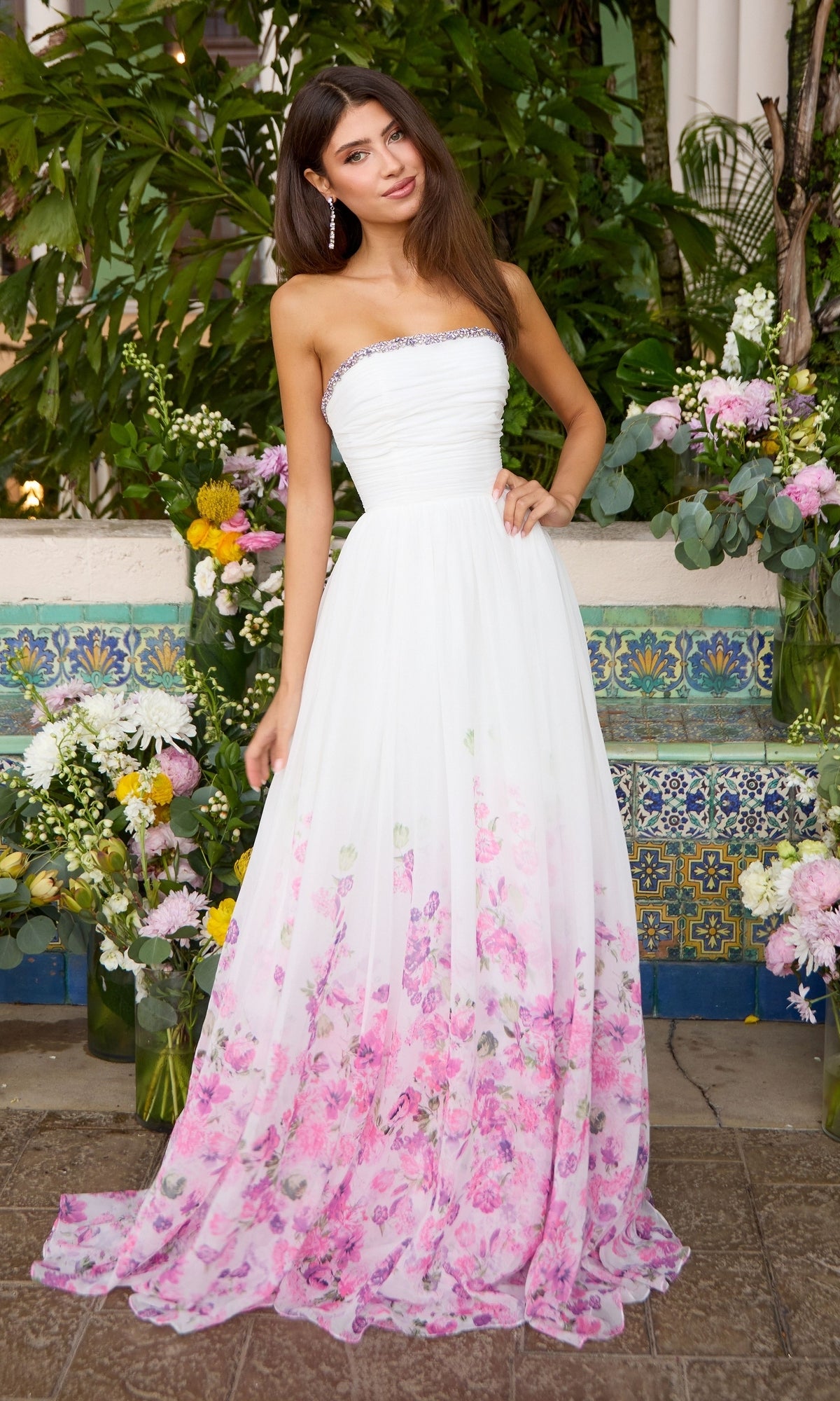 Ava Presley 43001 strapless white floor-length dress featuring a beaded neckline and an A-line skirt with a pink floral print.